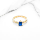 Bague - Or 10K jaune pierre bleue coupe poire cz avec bande twist - RIG421
