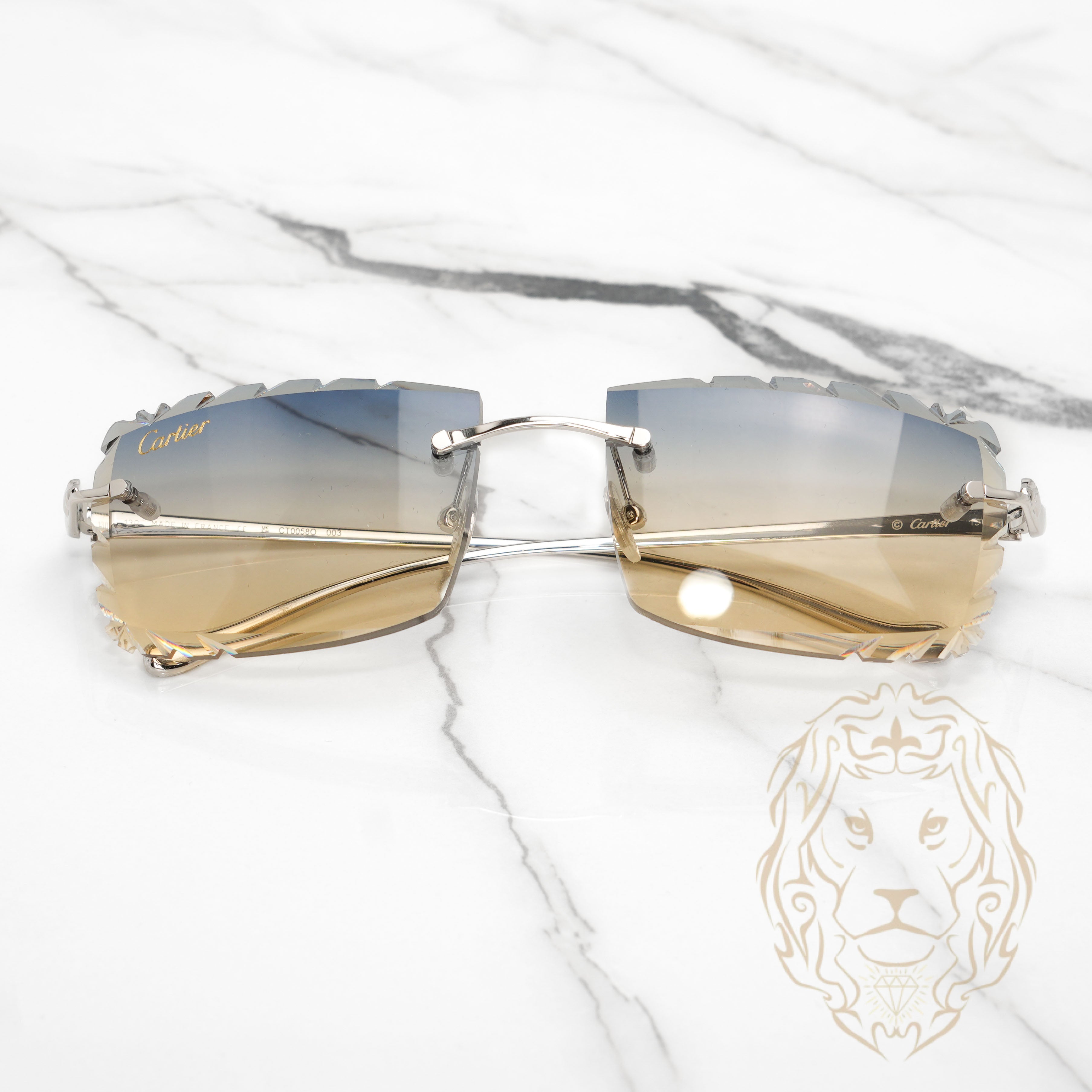 Lunettes Cartier –  Cartier Panthère argent avec verres coupe diamant or bleu dégradé - CT0058O-003