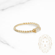 Bague - Or 10K jaune twist & pierre cz coupe baguette - RIG1120