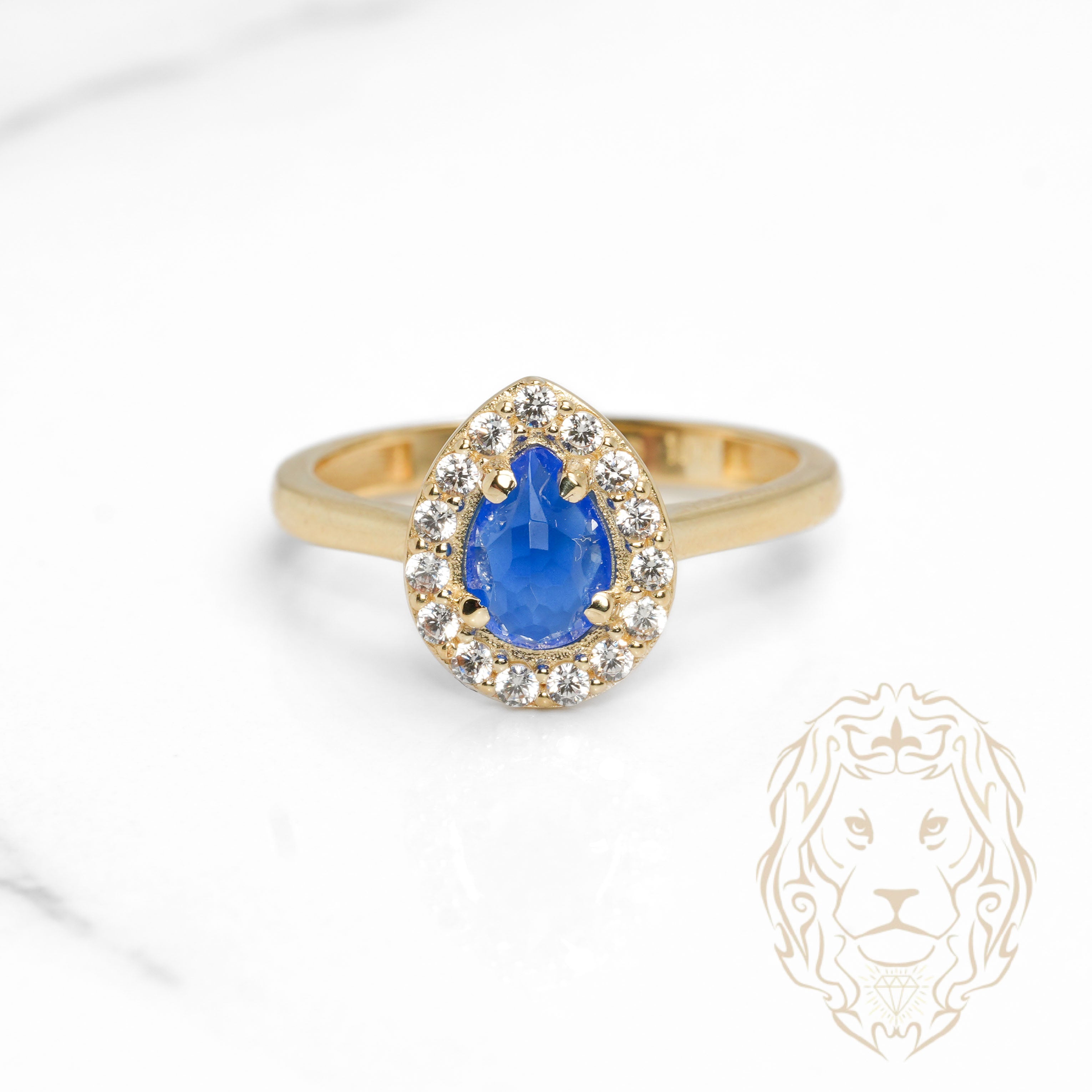 Bague - Or 10K jaune halo poire pierre bleue cz - RIG1133