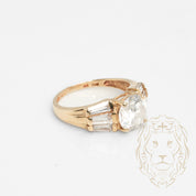 Engagement ring - 10K yellow gold central stone cz cut round & cz cut tapered baguettes - RIG727