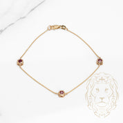 Bracelet - Or 10K jaune trois pierres rubis 0.36CT sertis clos - BRG587