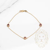 Bracelet - Or 10K jaune trois pierres rubis 0.36CT sertis clos - BRG587