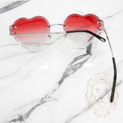 Lunettes Cartier – Cartier Picadilly Big C argent avec avec verres rouges en forme de cœur, coupe diamant dégradée – CT0092O-002