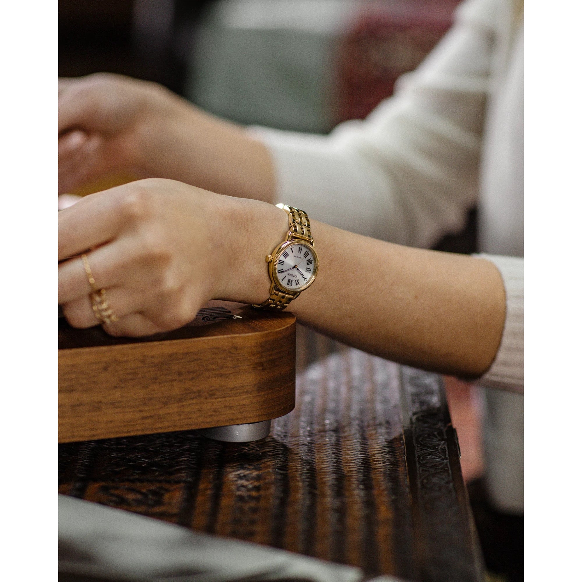 Citizen Classic Coin Edge EM1052-51A watch, silver dial, lifestyle
