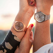 Swatch Skin Goldtralize SYXG110G watch, pink dial, on the wrist