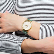 Swatch Skin Green Moire SYXG113 watch, yellow dial, on the wrist
