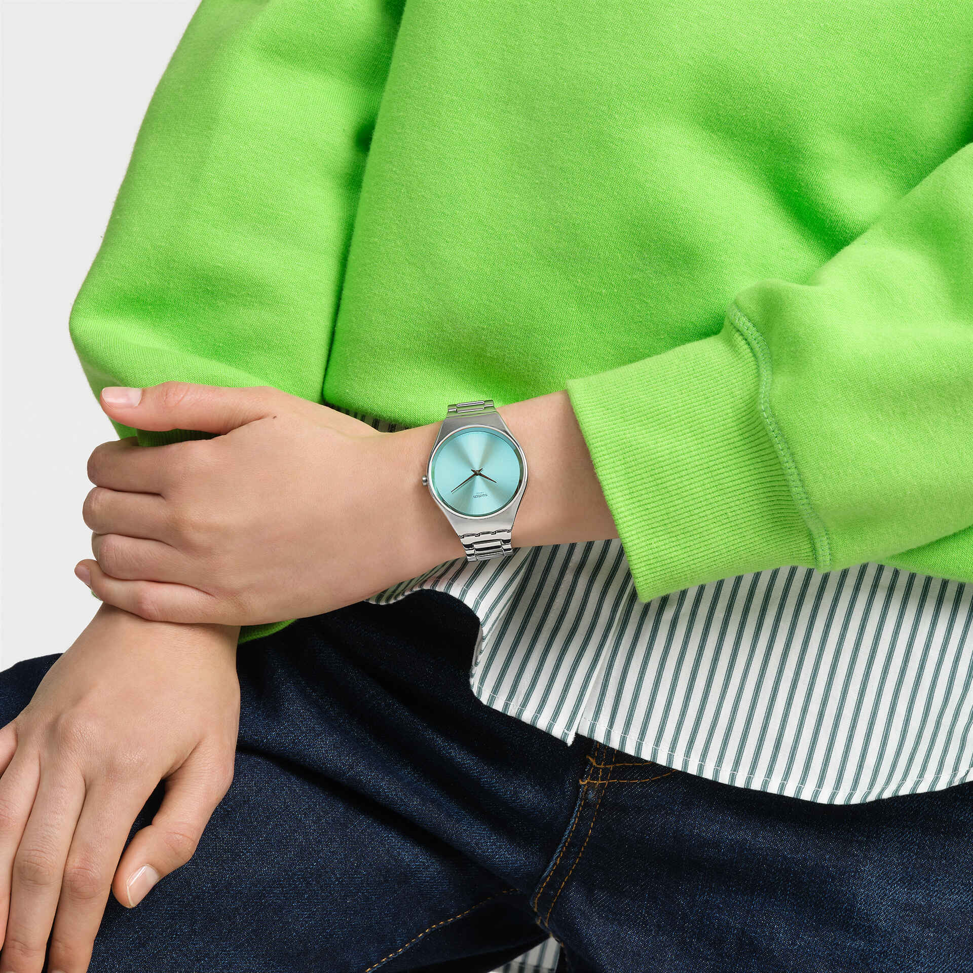Swatch Skin The Glow of Irony SYXS155G watch, grey dial, on the wrist