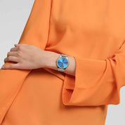 Swatch Skin Midday Sky SYXS156 watch, blue dial, on the wrist
