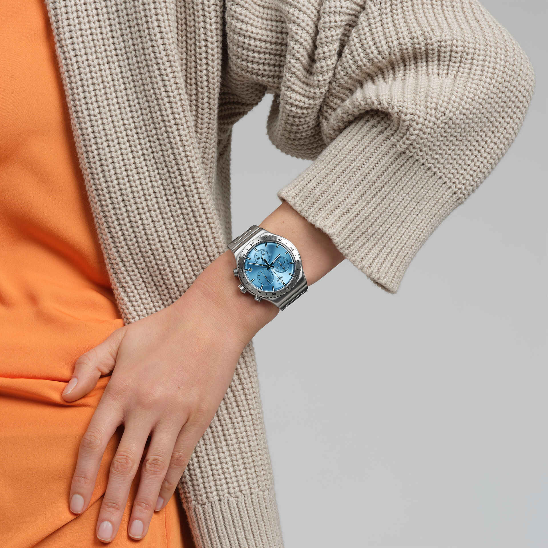 Swatch Irony That's So Peachy YVS528G watch, blue dial, on the wrist